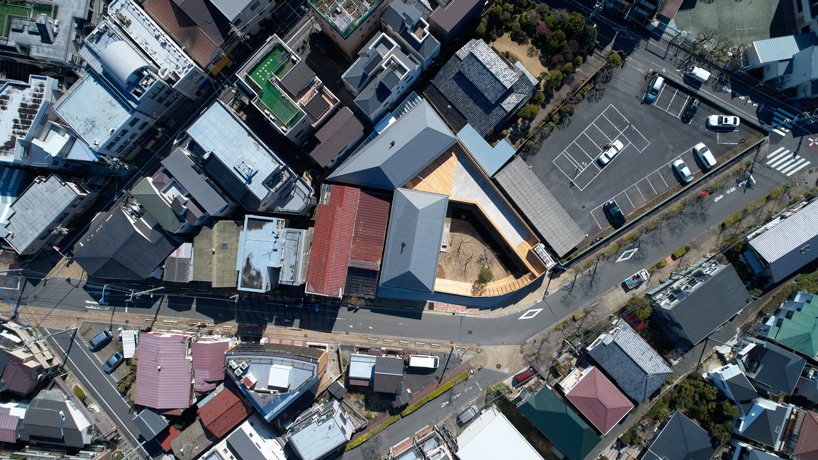 Naf Architect Design Encloses Small Pond Nursery School In Tokyo With Curved Wood Facade