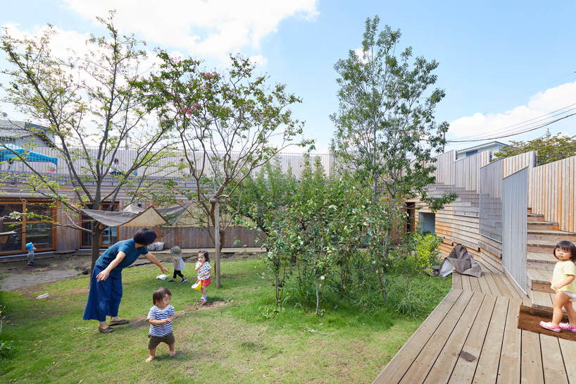 naf architect & design encloses 'small pond' nursery school in tokyo with curved wood façade