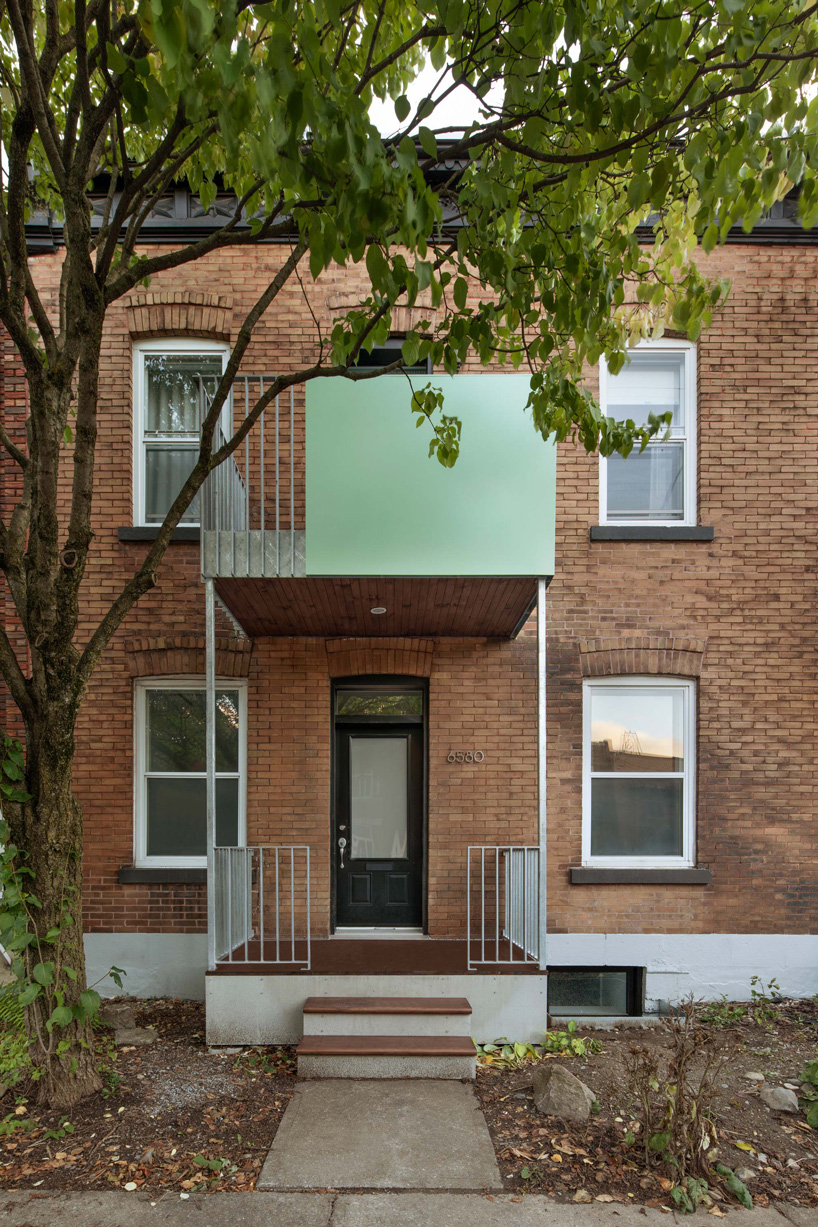 sage green staircase takes center stage in montreal residence renovation by naturehumaine