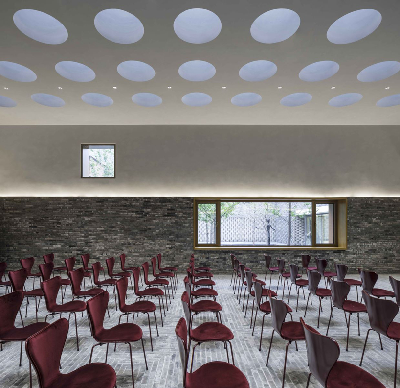 warm-toned aluminum panels clad neri&hu's junshan cultural center in beijing