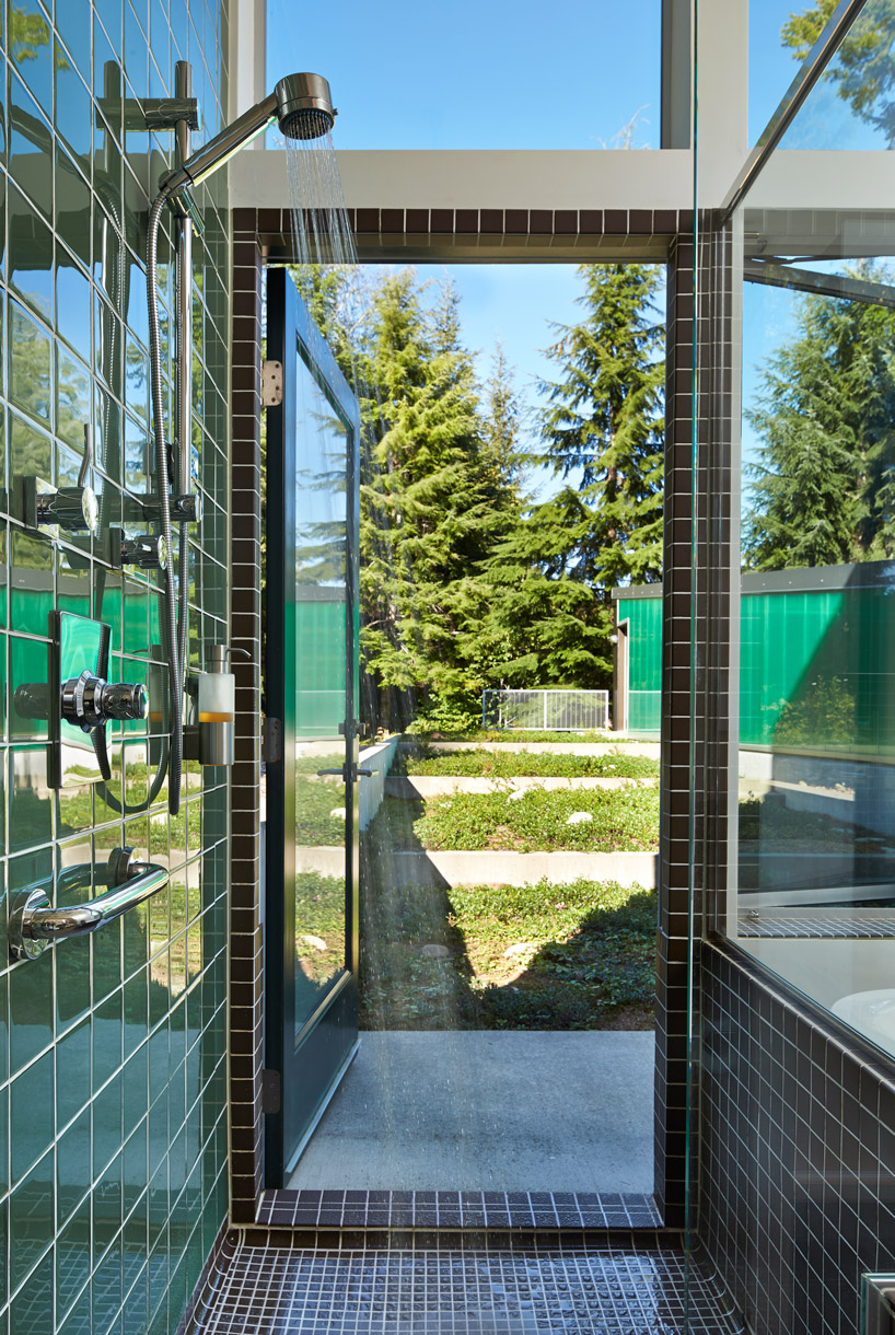 david coleman architecture designs cabin with angular forms and an illuminated facade in washington