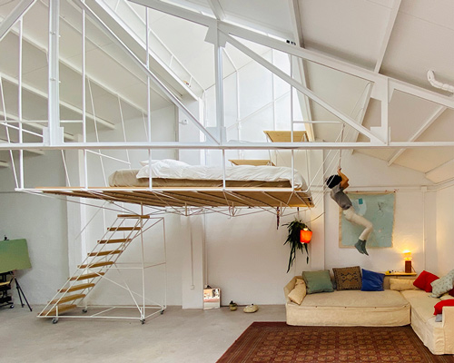 pía mendaro-designed artist's studio in madrid has a bed suspended from its ceiling
