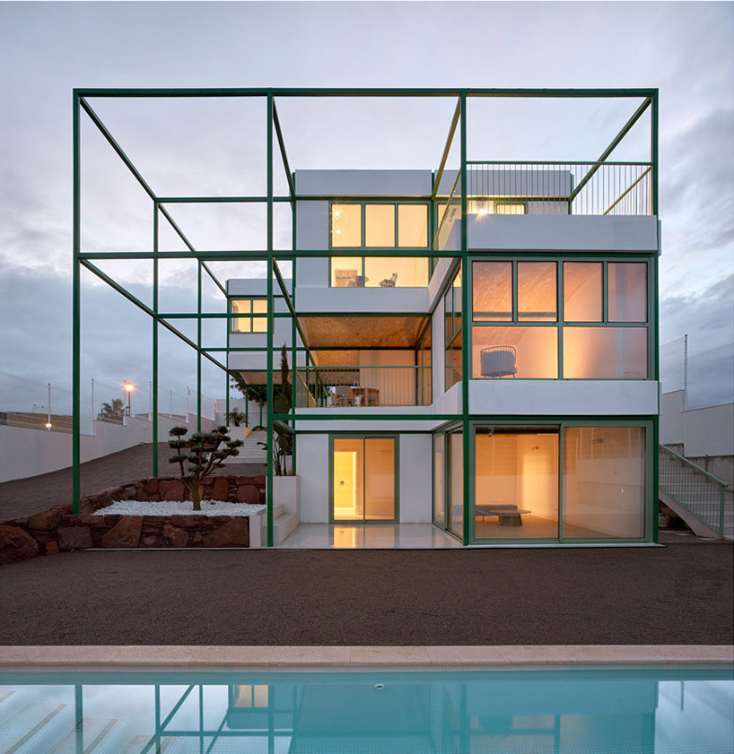 space popular forms valencia's brick vault house with a modular, bright green grid