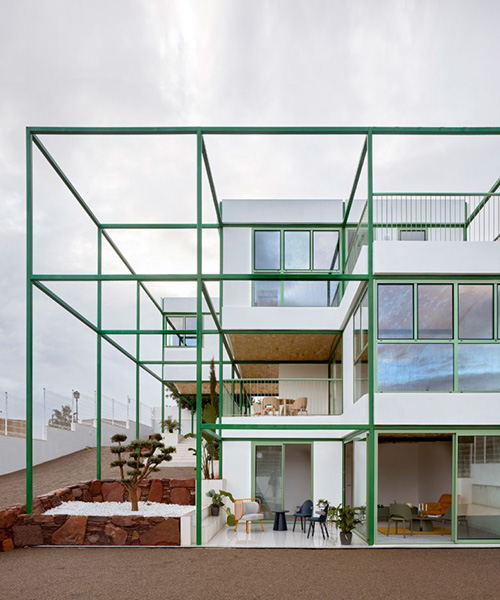 space popular forms valencia's brick vault house with a modular, bright green grid