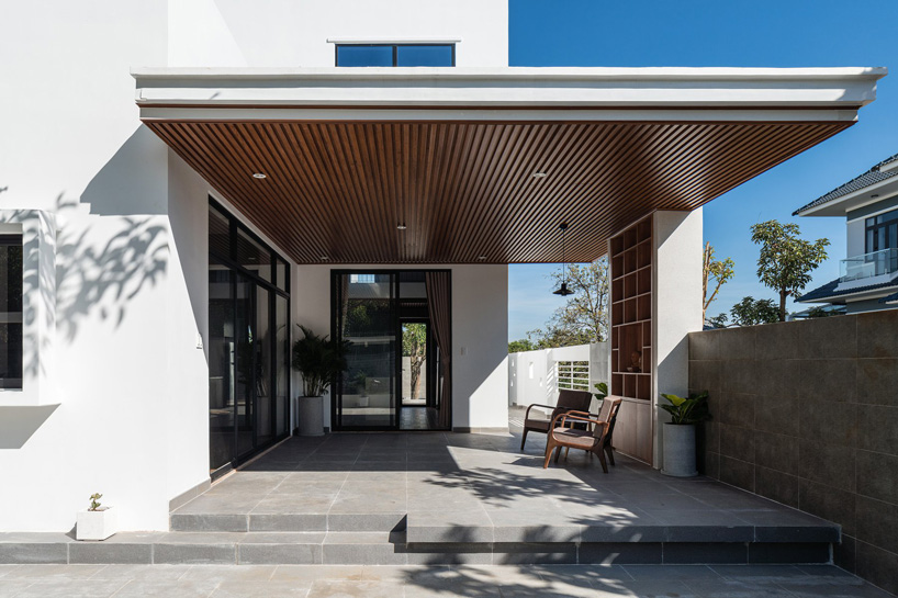 story architecture completes cubic white-hued house for young family in vietnam