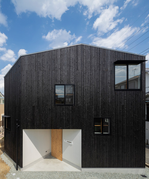 tato architects wraps house in takatsuki, japan, in charred wood exterior