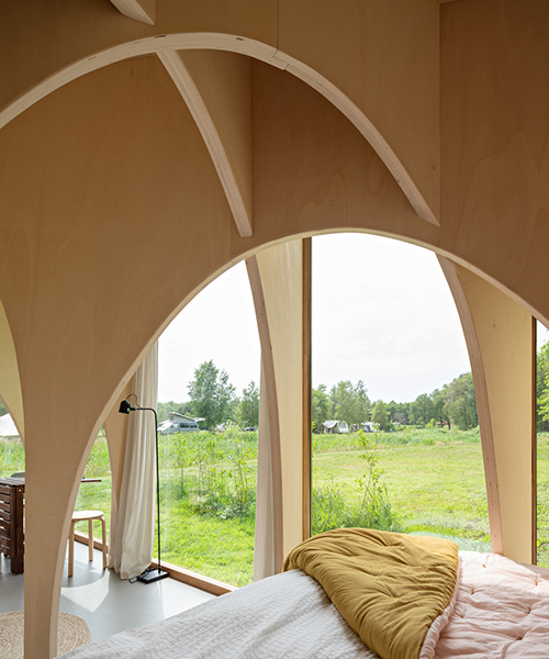 thewaywebuild fills its tiny forest cabin with an expressive network of timber arches