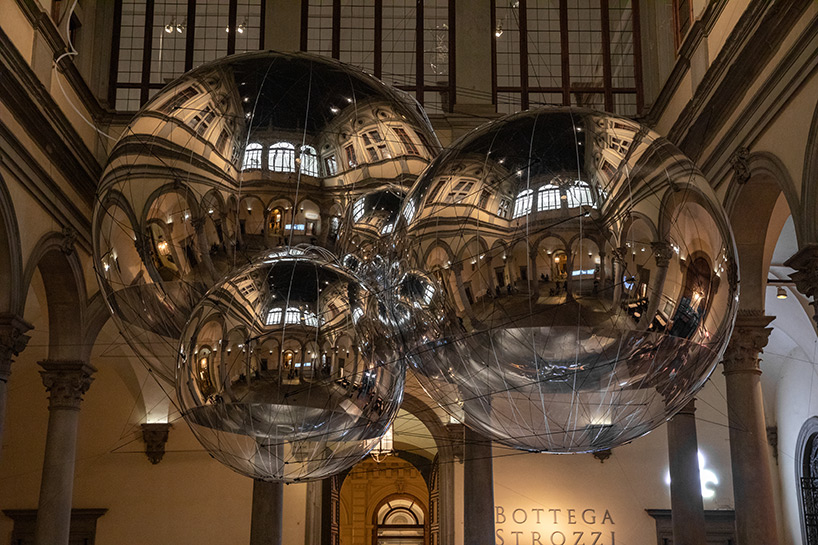 tomás saraceno brings illuminated spiderwebs, reflective spheres and more to palazzo strozzi