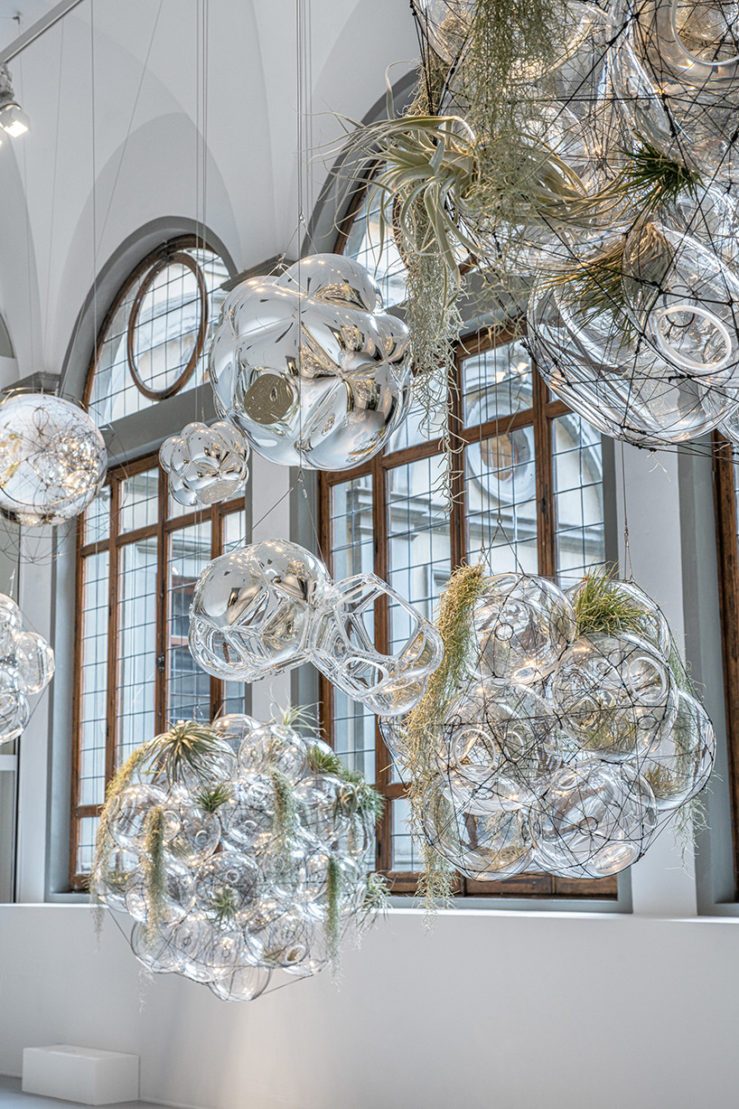 tomás saraceno brings illuminated spiderwebs, reflective spheres and more to palazzo strozzi