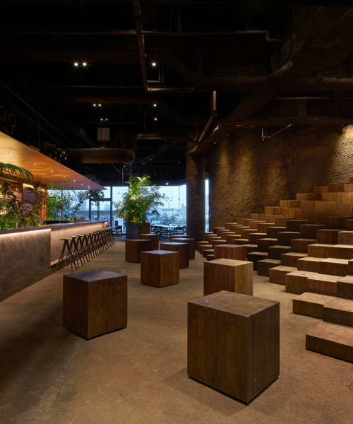 atelier tsuyoshi tane architects fills tokyo dining venue with trees and soil-lined walls