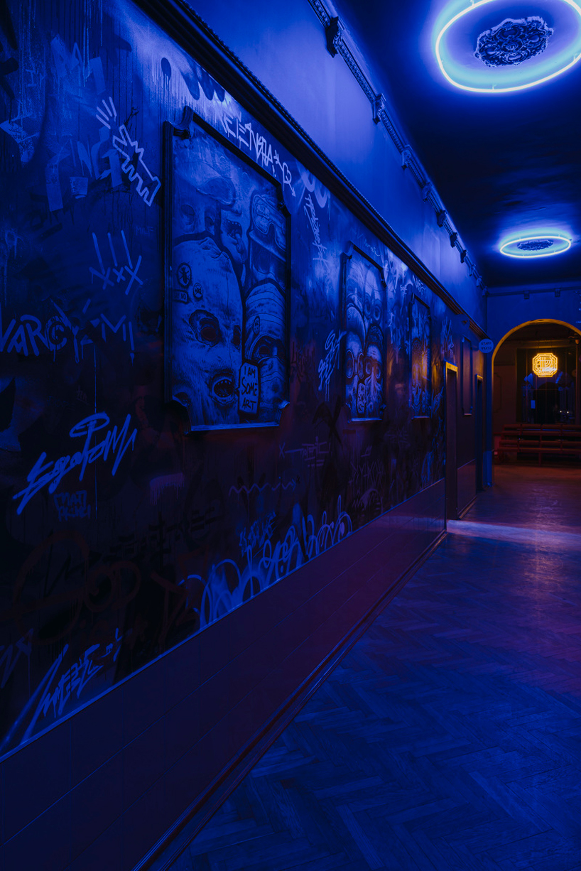 wiercinski studio mixes antiques with neon lighting to design vanity nightclub in poland