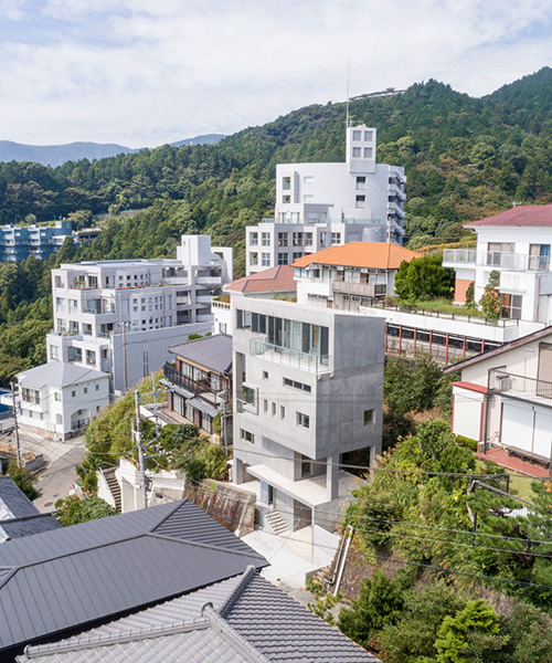 ashida architects sets concrete atami tower house on a steep slope in japan