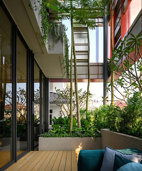 baan puripuri integrates balcony gardens into a residential project in bangkok