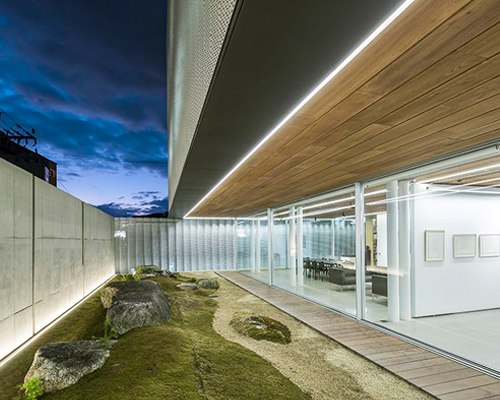 BCHO architects wraps perforated aluminum panels around a multi-use building in seoul