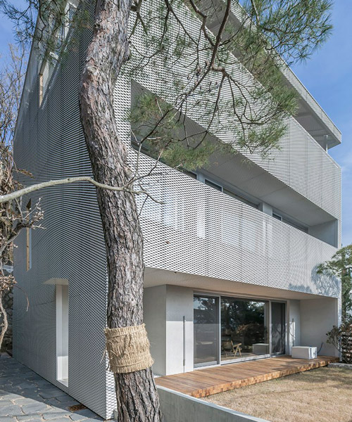 bcho architects associates clads house in seoul in a sheer metal screen