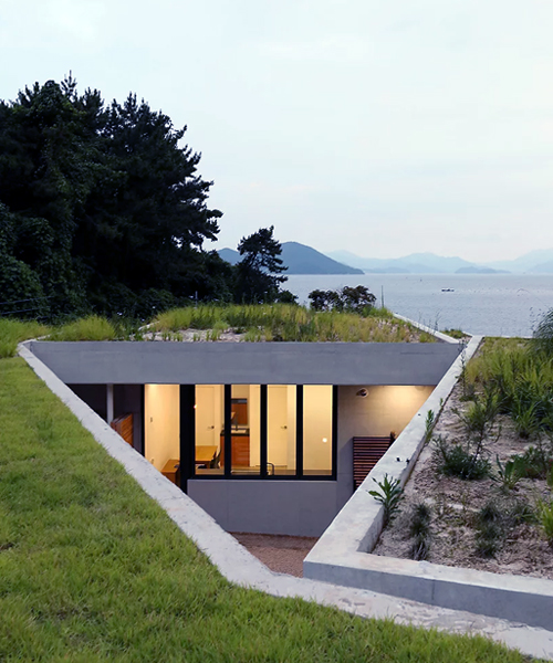 BCHO architects embeds a concrete guesthouse into the coast of south korea