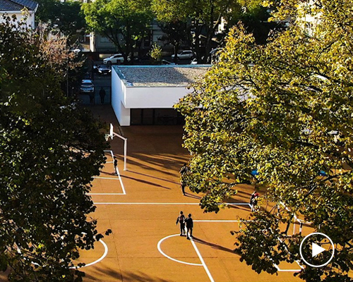 building pictures presents the renovation of a school surrounded by trees in porto