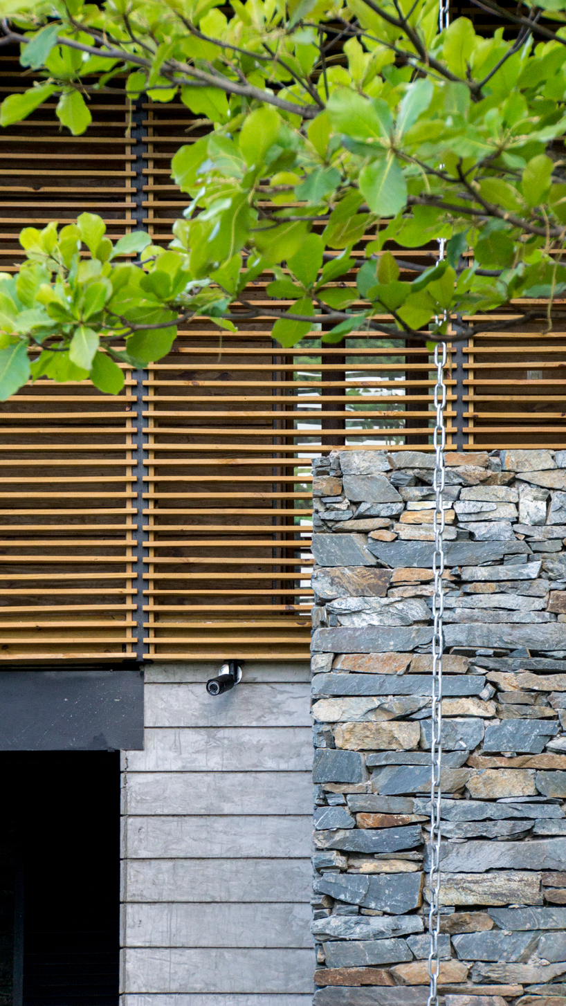 timber facades and sheltering eaves define casa del bosque by A20 arquitectos