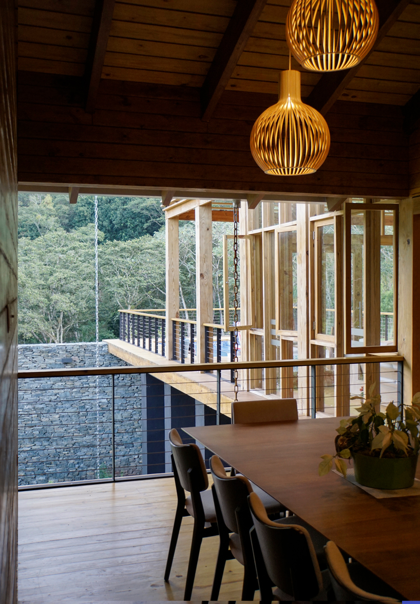 timber facades and sheltering eaves define casa del bosque by A20 arquitectos