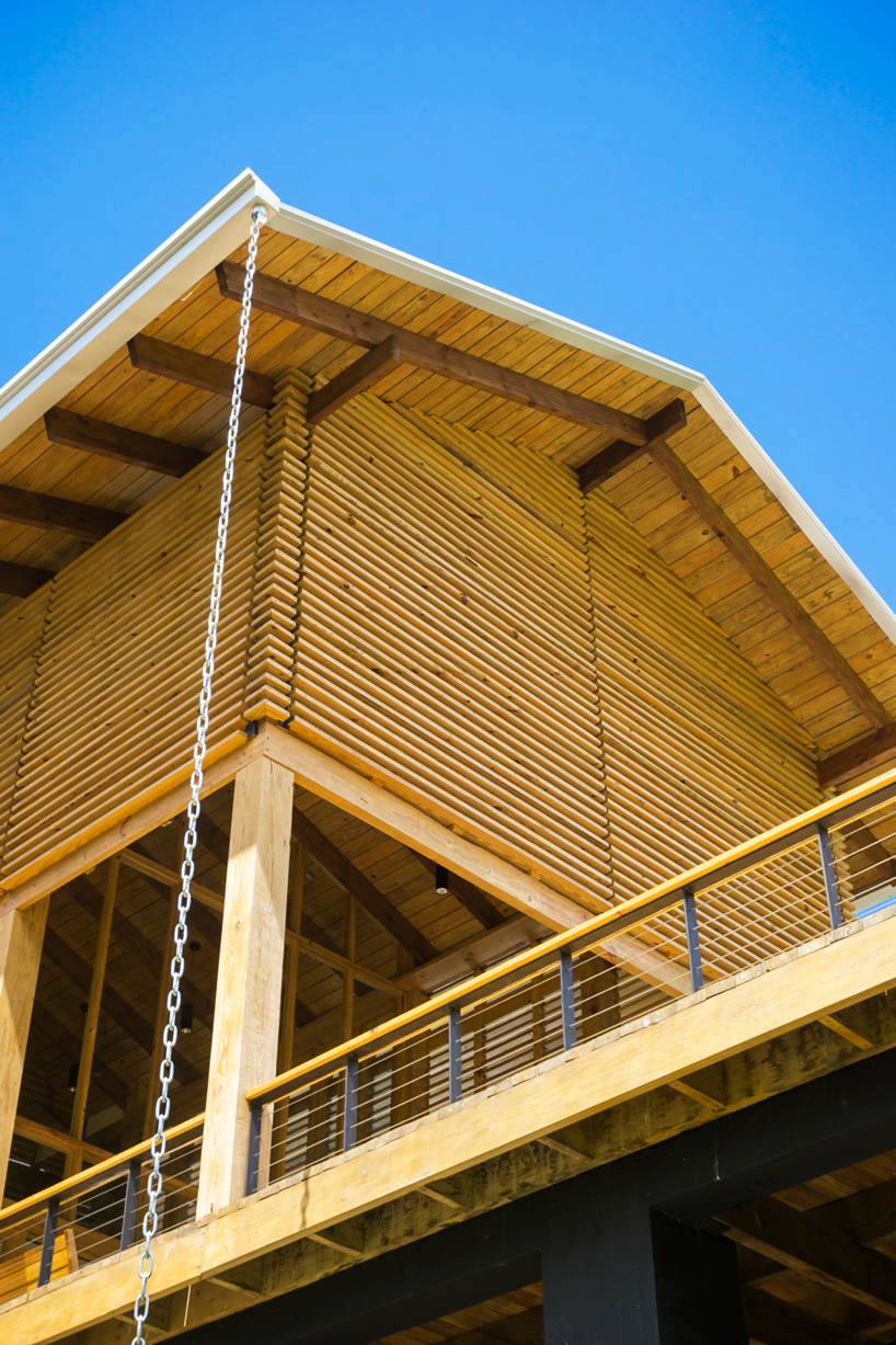 timber facades and sheltering eaves define casa del bosque by A20 arquitectos