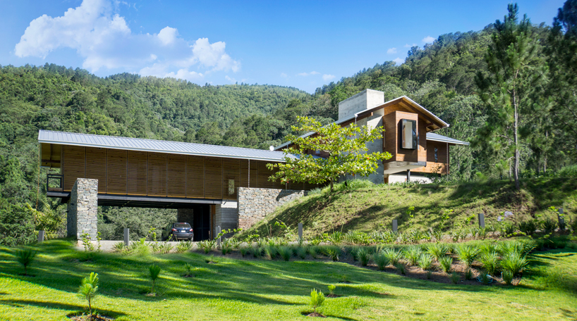 timber facades and sheltering eaves define casa del bosque by A20 arquitectos