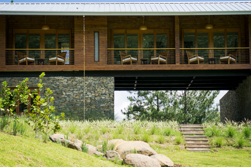 timber facades and sheltering eaves define casa del bosque by A20 arquitectos