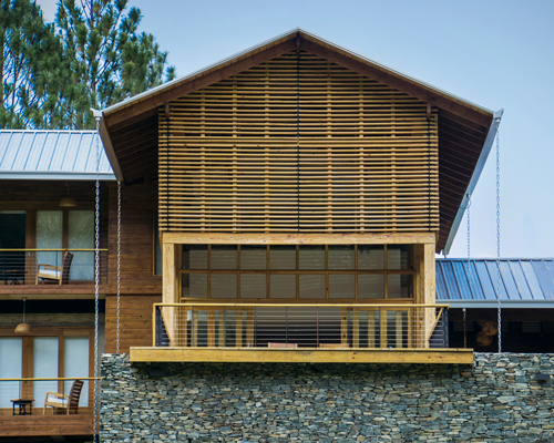 timber facades and sheltering eaves define casa del bosque by A20 arquitectos
