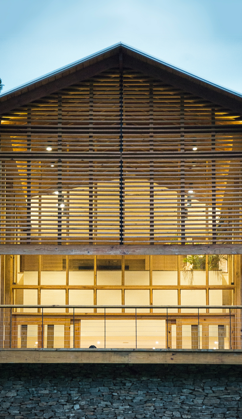 timber facades and sheltering eaves define casa del bosque by A20 arquitectos
