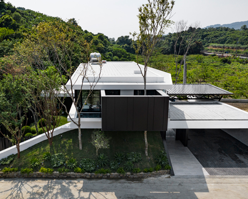chain10 designs modern home to blend seamlessly with taiwanese countryside