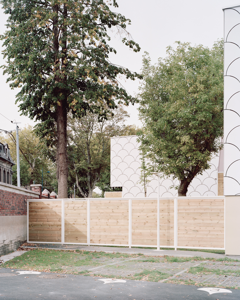 d'houndt + bajart extends an 'eccentric' french villa into eight social housing units