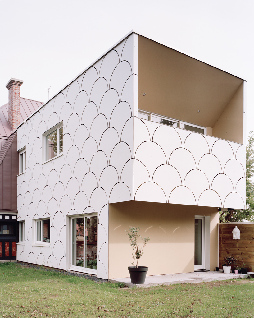 d'houndt + bajart extends an 'eccentric' french villa into eight social housing units