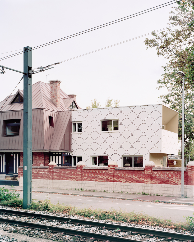 d'houndt + bajart extends an 'eccentric' french villa into eight social housing units