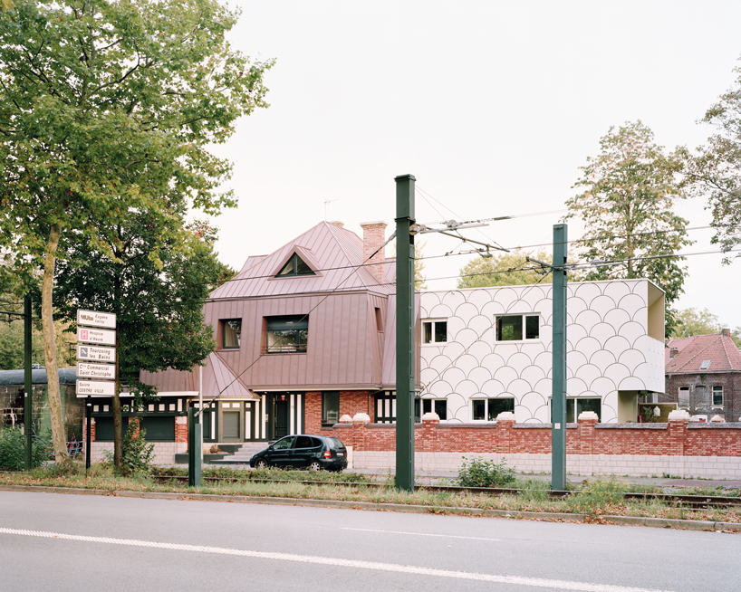 d'houndt + bajart extends an 'eccentric' french villa into eight social housing units