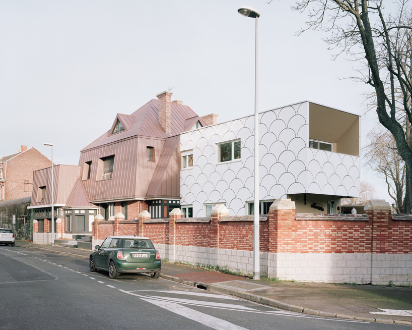 d'houndt + bajart extends an 'eccentric' french villa into eight social housing units