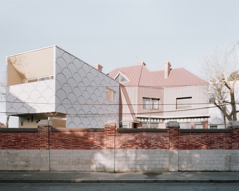 d'houndt + bajart extends an 'eccentric' french villa into eight social housing units