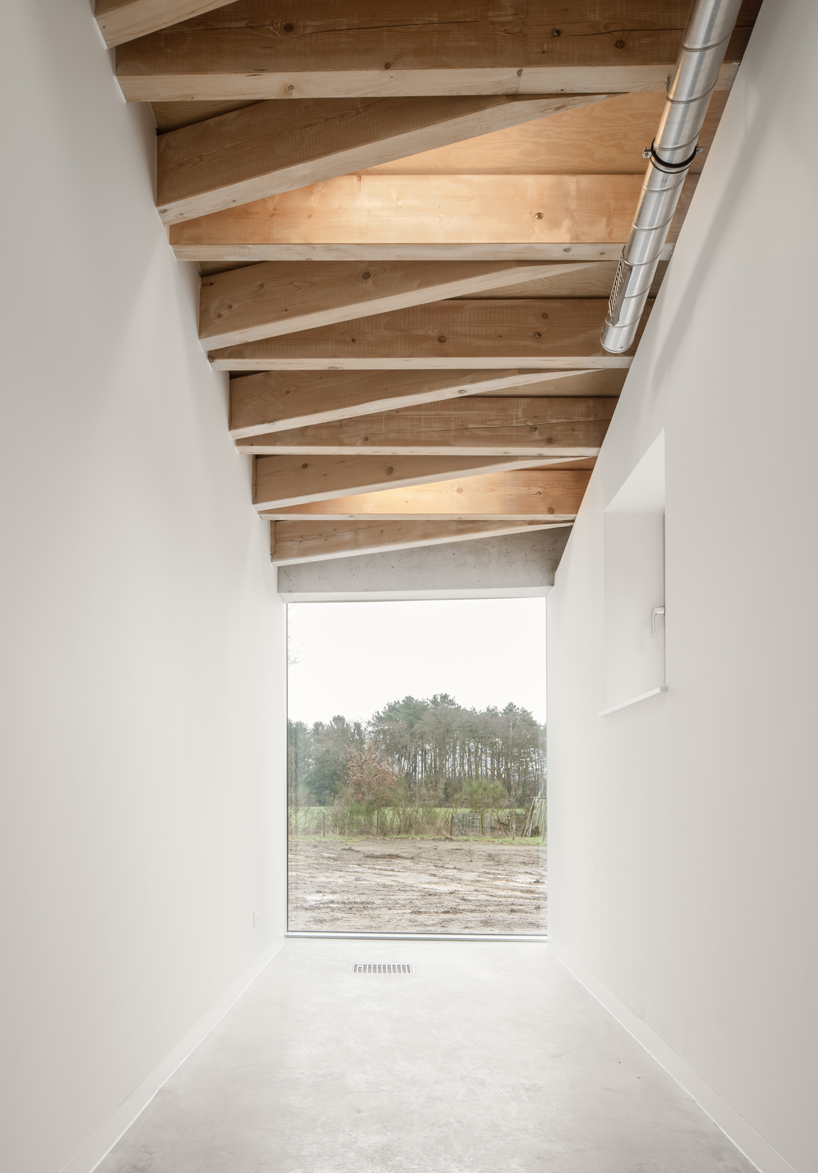 paris-based studio LIST and japanese architect hideyuki nakayama architects a conic roof of complex timber tops the frans masereel centrum pavilion in belgium