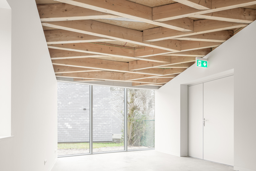 paris-based studio LIST and japanese architect hideyuki nakayama architects a conic roof of complex timber tops the frans masereel centrum pavilion in belgium