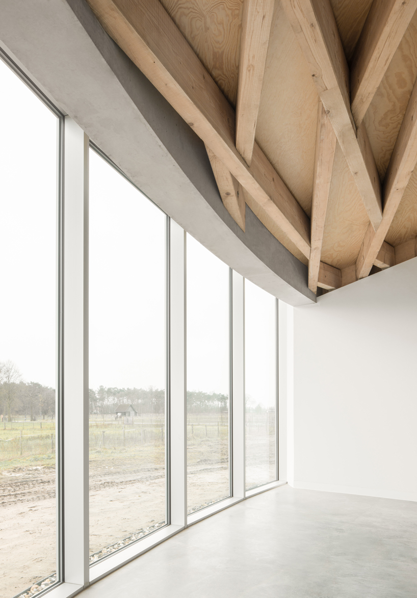 a conic roof of complex timber tops frans masereel centrum pavilion in belgium