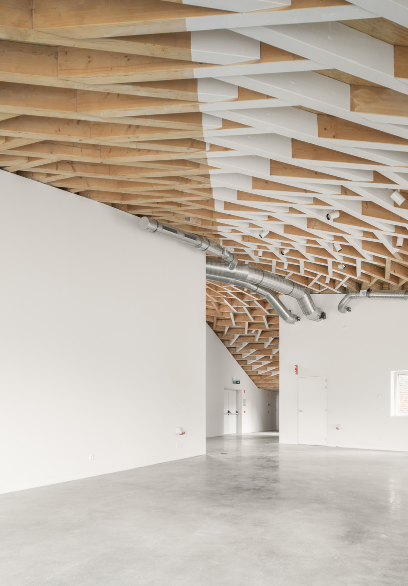 paris-based studio LIST and japanese architect hideyuki nakayama architects a conic roof of complex timber tops the frans masereel centrum pavilion in belgium