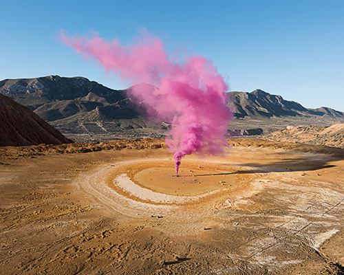 isabelle & alexis explode color bombs to create ephemeral and vivid scenes