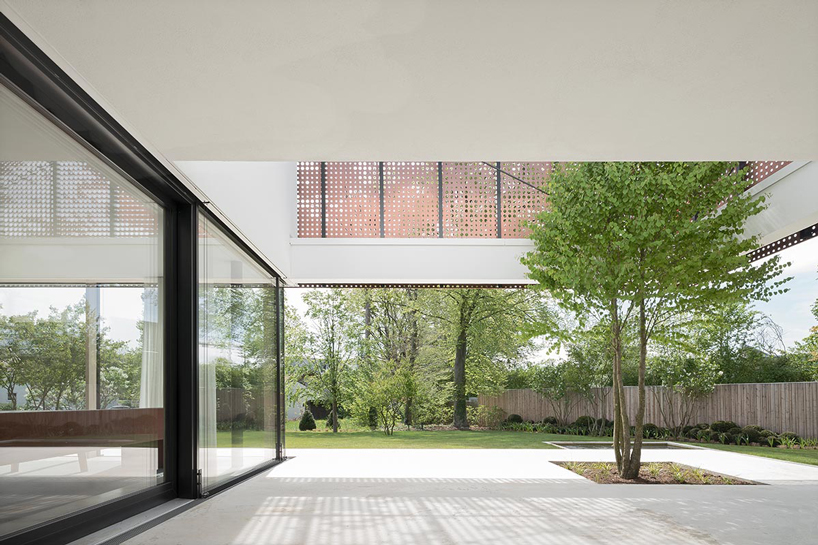 liebel architekten wraps house in niederbayern, germany, in perforated copper façade