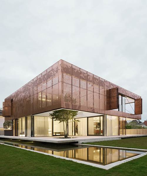 liebel architekten wraps house in niederbayern, germany, in perforated copper façade