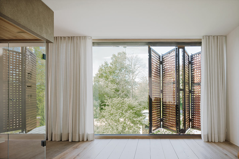 liebel architekten wraps house in niederbayern, germany, in perforated copper façade