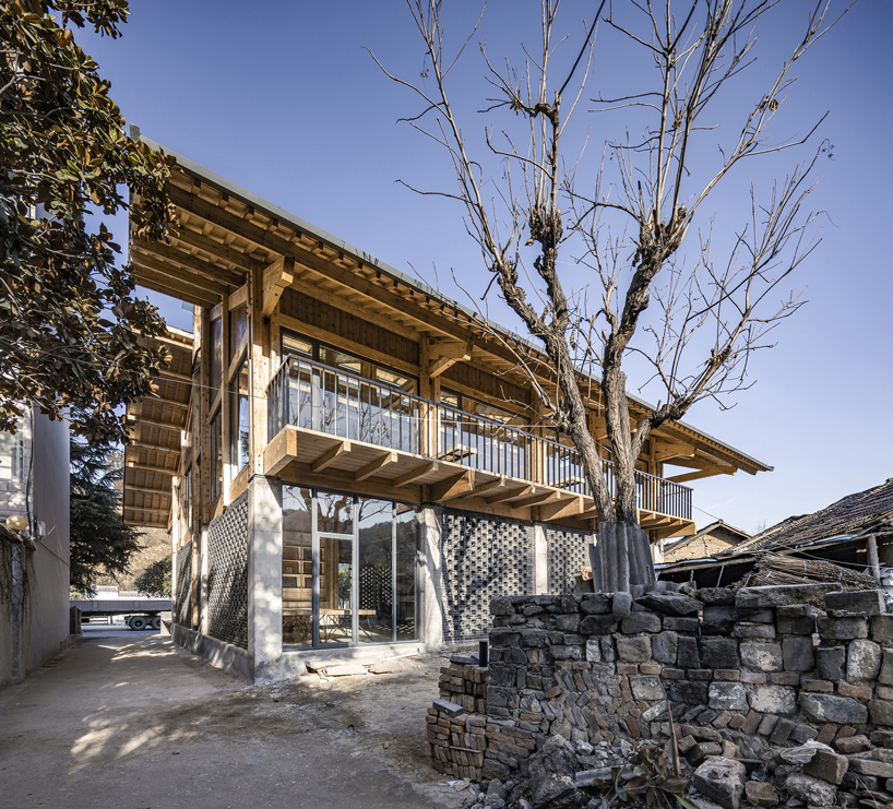 LUO studio uses a prefabricated timber structure to build community center in rural china designboom