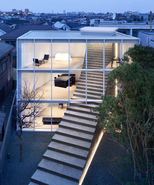nendo's stairway house leads into a light, plant-filled interior in tokyo