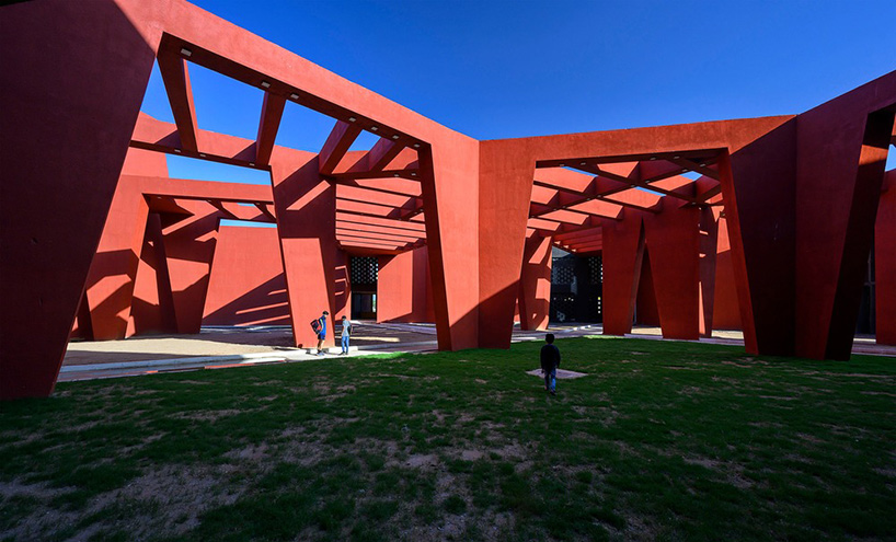 sanjay puri shades school campus in northern india with a network of angled red walls