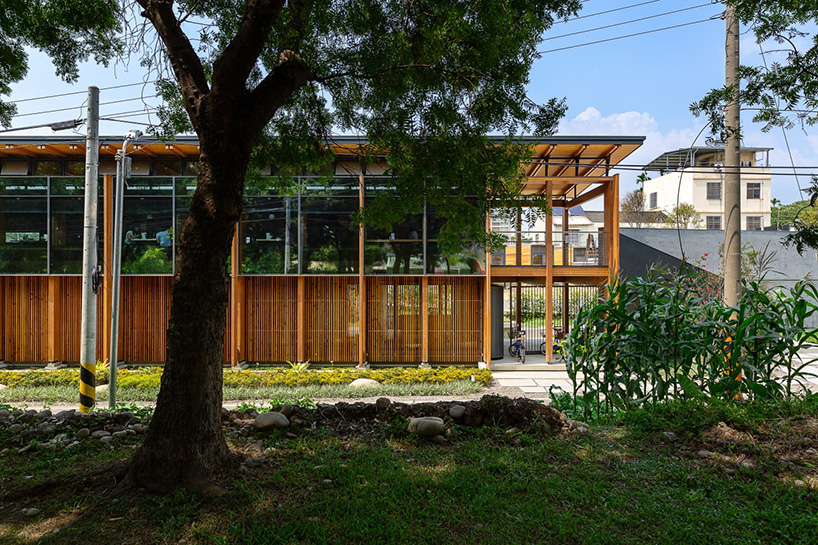 studiobase architects adds laminated wood façade to restaurant in taiwan