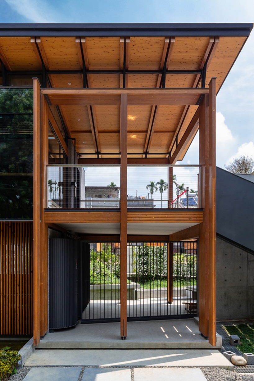 studiobase architects adds laminated wood façade to restaurant in taiwan