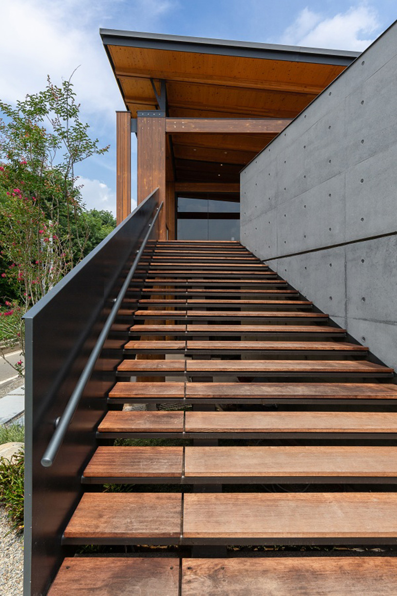 studiobase architects adds laminated wood façade to restaurant in taiwan