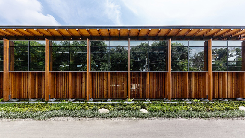 studiobase architects adds laminated wood façade to restaurant in taiwan